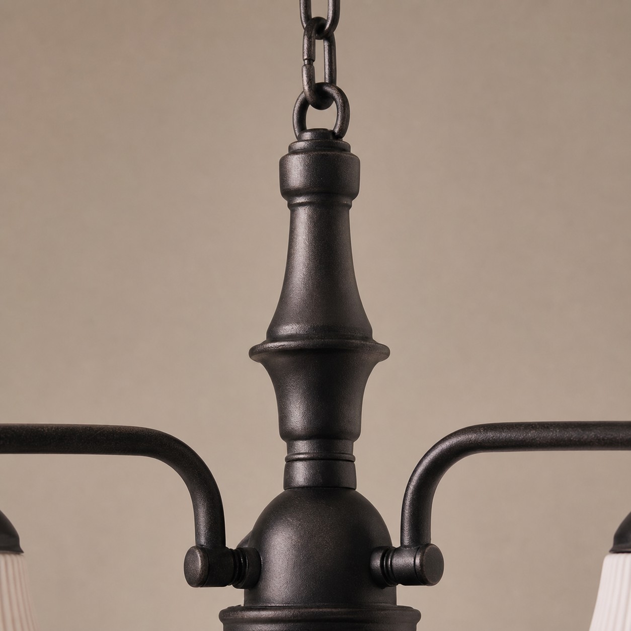 Close view of black iron center column and chain